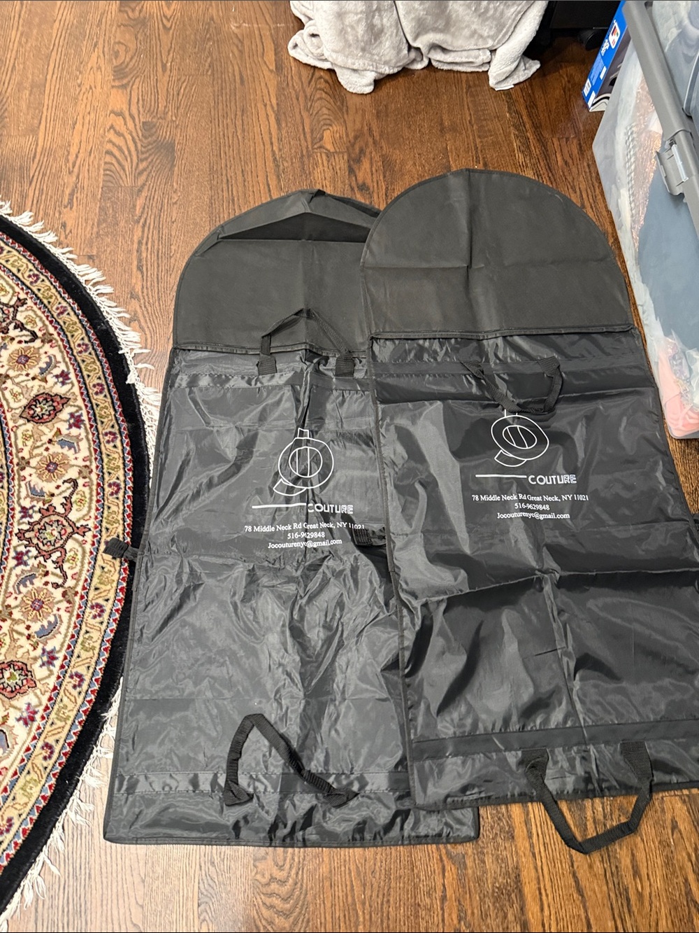 Bundle of 2 Black Garment Bags with zippers and 2 pouch pockets and handles. 50”